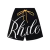 La versión correcta de Rhu Jacquard letra lana tejida cordón elástico High Street American Casual versátil pantalones sueltos 5/4