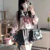 Abiti da lavoro Ragazza della scuola giapponese Uniforme JK Donne Ragazze Kawaii Fiocco Camicette rosa Gonne a pieghe Set Abito da marinaio Costumi blu scuro