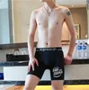 Sous-vêtements jeunesse glace soie allongé hommes sport fitness anti-usure jambes marche légère confortable respirant longue jambe boxer shorts pantalon