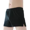 Underpants respirável homens mid-rise cintura elástica shorts masculinos com divisão lateral para casa sleep wear solto ajuste sólido