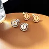 2023 New Luxury S925 STERLING SILVER JEWELRY LUCY MOVE STUD STUD ROUND COIN DESIGN TRENDY SLIDE MOVING CZ CUBICジルコンストーンE218K