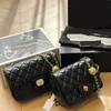 Borsa di design Borsa a tracolla da donna Classica oro nero Qualità di lusso Morbida catena in pelle di agnello piccola Borsa a tracolla con pallina dorata Borsa alla moda