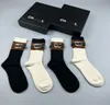 Luxury 24ss designer socks for men and women casual sports socks autumn winter warm mid-thigh stockings made of cotton with fashionable letter design