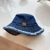 Tassel Edge Designer Bucket Hat Sun Shading Outdoor Vacation Denim Beach Hat Showcasing Face Small Metal Letters Minimalist Fisherman Hats