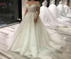 2023 Vintage A Line Wedding Dresses Off Shoulder Lace Appliques Crystal Beaded Illusion Sweep Train Tulle Arabic Plus Size Formal 2645155