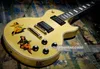 Custom Shop Steve Jones gele crème elektrische gitaar Pin Up Blonde Girl Sticker Pearl Block Inlay Humbucker pickups Gouden hardware Grover Tuners Op voorraad Verzending snel