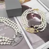 Colliers pendentifs Mode de luxe femmes planète pendentif collier populaire Vintage bohème trois rangées collier de perles célèbre designer exquis petite planète reine Mo