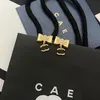 Luxe boog vergulde oorbellen Womens Boutique sieraden Coppe Designer merk sieraden oorbel hoge kwaliteit met stempel oorbellen