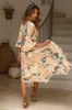 Casual klänningar 2024 Kvinnor som skriver ut lång maxi klänning V-ringning Petal Sleeve Beach Robes Oregelbunden längd Wrap Floral Holiday Vestidos