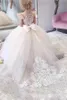 Robes de fille de fleur en dentelle de tulle avec arc bébé filles robe de fête de mariage d'anniversaire robe de princesse à manches bouffantes pour enfants 240309