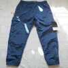 Designer Pantaloni cargo Stone-islandness Tasca in nylon metallico Distintivo ricamato Pantaloni casual Pantaloni sottili riflettenti dell'isola Taglia M-2XL alta 94