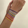 Bracciale da donna con perline di riso colorate intrecciate geometriche personalizzate con colori a contrasto in stile spiaggia minimalista impilati