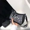 Sacs de conception en gros et au détail d'usine cette année petit sac lumineux populaire pour les femmes été 2024 nouveau sac à main de mode Net rouge épaule aisselle