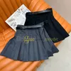 Mini jupes d'été Sexy avec Badge classique, taille haute, robe trapèze pour femmes, jupe plissée avec ceinture, robes plissées de Style collégial