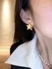 Ontwerper's vijfhoekige steroorbellen dames overdreven temperament Europese en Amerikaanse gouden oorbellen unieke mode en gepersonaliseerde ooraccessoires