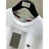 Designer de luxo masculino t-shirt preto vermelho impresso camisa de manga curta marca de moda designer top camiseta tamanho europeu carta padrão decoração logotipo 1025