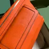 2024 Luksusowa designerska torba z paskiem przednie magnetyczne zamek zamek zamek regulowany pasek na ramię, Crossbody Premium Orange Bag