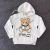 manteau pour enfants vêtements de marque pour enfants vêtements pour bébé t-shirt MOSC filles garçons sweats à capuche manches parentales lettres d'ours d'été noir blanc rose vêtements pour enfants dhgate vêtements pour bébé