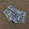 Kvinnors shorts ultra-låg stigning denim shorts mager sexiga hål heta byxor korta femme ld240312