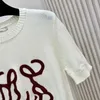 Kvinnors stickor Tees Designer Brand 2024 Spring Festival Ny handduk broderad rund hals Kort ärm stickad t-shirt CKCM