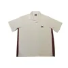 Mens Casual Shirts Apricot Needles Awge Män Kvinnor Cowboy broderad fjäril Pocket Shirt Topps Tee 20W0