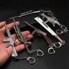 Keychains Lanyards 1pc Toy Gun Keychain Alloy Toy Gun Model Pendant Car Key Chain Car Key Ring Gift For Men Boys ldd240312