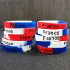 Braccialetto all'ingrosso Bulk 20 pezzi Francia bandiera nazionale stampa braccialetti in silicone blu rosso bianco colore sport paese braccialetti in gomma gioielli ldd240312