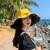Large bord chapeaux seau à la mode femmes protection solaire chapeau de plage printemps et été grand bord de seau UV UPF 50 + Q240312