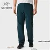 Designer joggingbroek Arcterys ARC 'TERYS Archaeopteryx RAMPART PANT Ademende heren sneldrogende broek labyrint/donker turkoois 32 HBHN 338