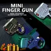 Gun Toys Toys Toys Nowa mini skorupa do rzucania bronidą dekompresyjną zabawkę metalowy wizerowy pistolet na palcach może biegać na prezent dla chłopca 2400308