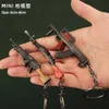 Schlüsselanhänger Lanyards Hot Game Schlüsselbund Schmuck Waffe Mini Gun Modell Metall Anhänger Schlüsselanhänger Mode Chaveiro Tasche Autoschlüsselhalter Geschenk für Kinder Männer ldd240312