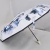 女性デザイナー傘の黒と白の色自動傘の現代の女の子と文字パターン