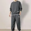 Tute da uomo Tuta da uomo a maniche lunghe Felpa con texture waffle con pantaloni jogger in vita elastica Set per sport casual Vestibilità ampia