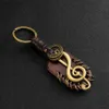 Porte-clés Longes 2024 Mode Vintage Marron Véritable Cuir Boussole Musique Symbole Porte-clés Charme Travail Manuel Alliage Accessoires Hommes Porte-clés ldd240312