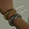 Bangle 18K Gold Plated Titanium Steel Bracelet عتيقة مرنة التلميع التلميع للنساء الفتيات الموضة المجوهرات الجمالية LDD240312