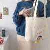 2024イブニングバッグIns Duck Embroideryキャンバストートバッグ2024女性と女の子のショッピングのためのソフト大きな肩の作業ハンドバッグ