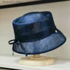 Cappelli a tesa larga Cappelli a secchiello di alta qualità concavo superiore filato di canapa materiale decorazione dell'arco cappello da pescatore femminile retrò semplice cappello da sole da spiaggia Q240312