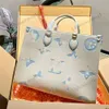 Tasarımcı On Momy Bag Büyük Kapasite Çapraz Bag Moda Çantaları Kadın Omuz Çantası Lüks Deri Tote Klasik Dizüstü Tag Alışveriş Çantası Depolama Çantası 240312