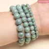 Strand Fashion Calcédoine verte naturelle Birmanie Jade Bracelets Hommes et femmes Bijoux de charme Guérison Corde élastique Couple Perle 6/8/10 / 12mm