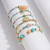 Boheemse stijl kralenarmband met rijstkralen en 6-pack meerlaagse armband met schoonheidshoofd en muntkwastjes
