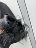 Trajes de mujer Blazers Chaqueta de traje negra con cuello en V estilo Miu de diseñador con diseño de patchwork de pelo de avestruz, top suelto y moderno, cárdigan de mujer primavera nuevo MUQ9