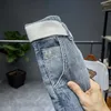 Jeans para hombres 2024 Tendencias de primavera y verano Pantalones bordados cónicos hasta los tobillos sueltos Harem holgados