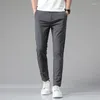 Pantaloni da uomo 2024 estate Casual uomo sottile business stretch sottile elastico in vita Jogger coreano classico nero grigio blu pantaloni maschile