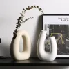 VASES NORDIC CERAMIC VASE MODENT MINIMALIST ABSTRACTION VASE VASE HOME DECOR Officeリビングルーム結婚式の装飾モダンな幾何学的な花瓶の贈り物