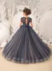 Elegante schwarze Blumenmädchenkleider Puffy Lace Ballkleid Tüll ärmellos für Hochzeiten Erstkommunion Festzug 240309