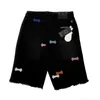 Shorts pour hommes La version correcte du patch Croix avec des embellissements de fleurs croisées, un jean en cuir patch lavé, une tendance unisexe américaine high street 6B95