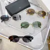 Gafas de sol de diseñador para mujer Triomphe montura ovalada Gafas de sol mujer patas de espejo de metal lente verde retro pequeño marco redondo sexy pequeñas mujeres gafas hombres con caja