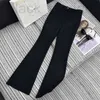 Pantaloni da donna Capris firmati 2024 Inizio primavera Nuovo Nanyou PRA Moda Versatile Dimagrante Triangolo invertito Etichetta Vita abbellimento Corno Nero UVGX