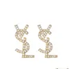 Designer18k guldpläterad österrikisk kristallbrev örhängen för kvinnor europeiska och USA populära enkla designerörhängen bröllop brud smycken gåva02 2024 catego