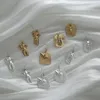 Boucles d'oreilles pendantes AOMU 2024 Statue d'animaux tridimensionnels en métal creux irrégulier abstrait courbe de corps conception boucle d'oreille pour femmes cadeaux
